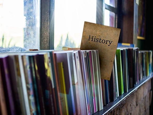 Book shelf with a History text book visible